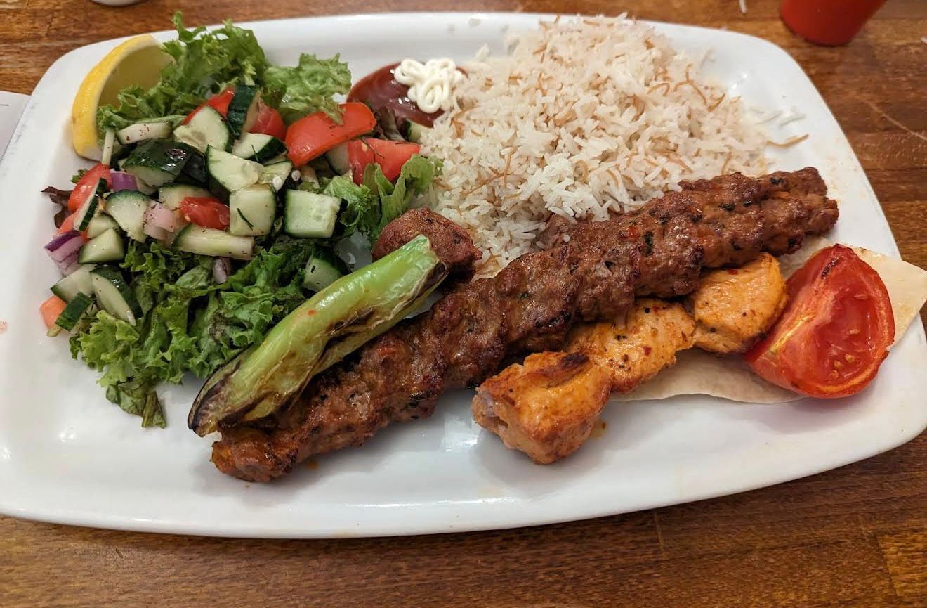 Mixed kebab platter with Adana kebab, chicken shish, rice and fresh salad